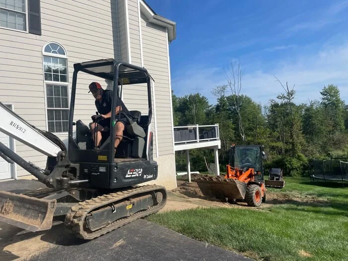Residential hardscape creation with under deck and subsurface drainage renovation, landscape creation and low voltage lighting addition project in Jamison, PA